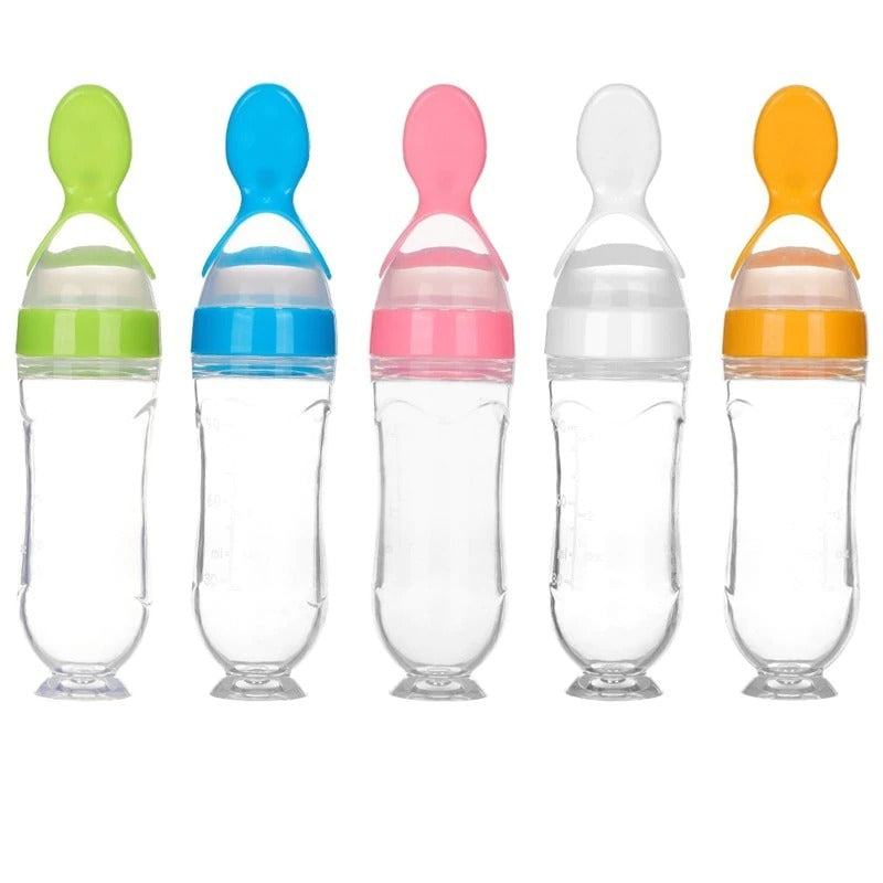 https://toddlertidbits.com/cdn/shop/products/baby-spoon-bottle-feeder-dropper-silicon_main-5.jpg?v=1680983289&width=1946